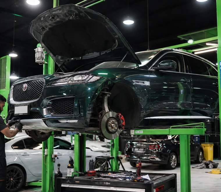 Jaguar F-Pace raised for undercarriage access at the Dubai workshop