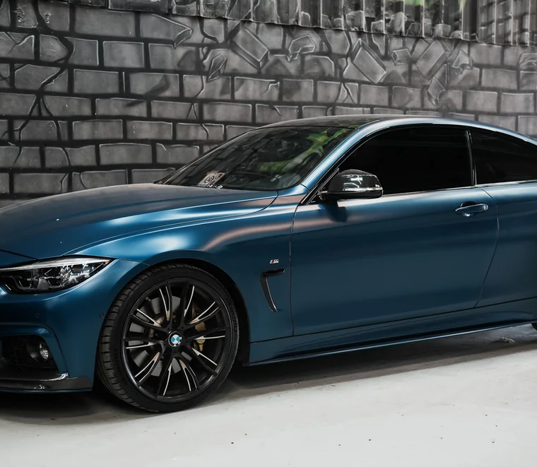 Frozen blue BMW 4 Series coupe finished and ready for collection at System X Car Care, Dubai.