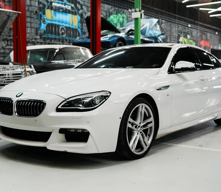 White BMW 6 Series Gran Coupe in for service at the System X Car Care workshop in Al Quoz, Dubai, Dubai.