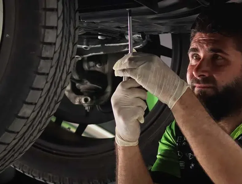 Car raised for a major service at the System X Car Care workshop in Al Quoz, Dubai, Dubai